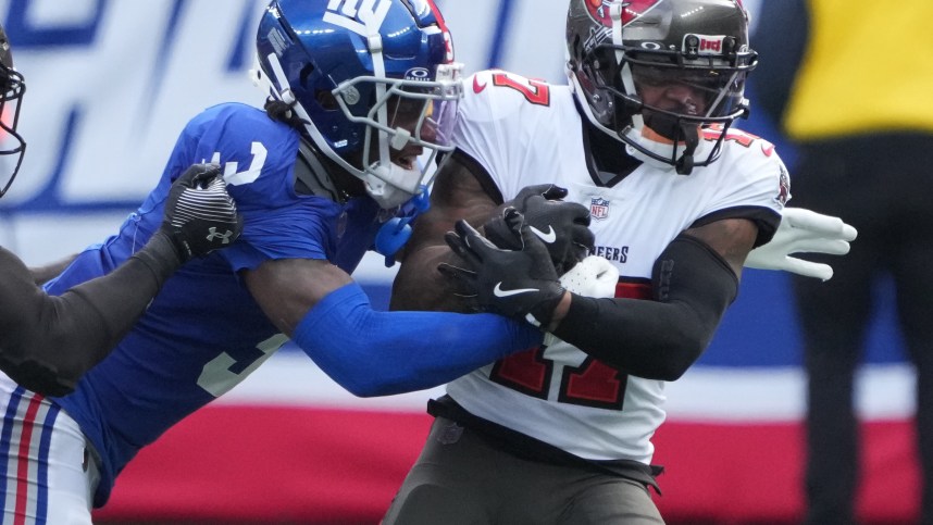 Nov 24, 2024; East Rutherford, New Jersey, USA; Tampa Bay Buccaneers wide receiver Sterling Shepard (17) catches a pass against New York Giants cornerback Deonte Banks (3) during the first half at MetLife Stadium. Mandatory Credit: Robert Deutsch-Imagn Images