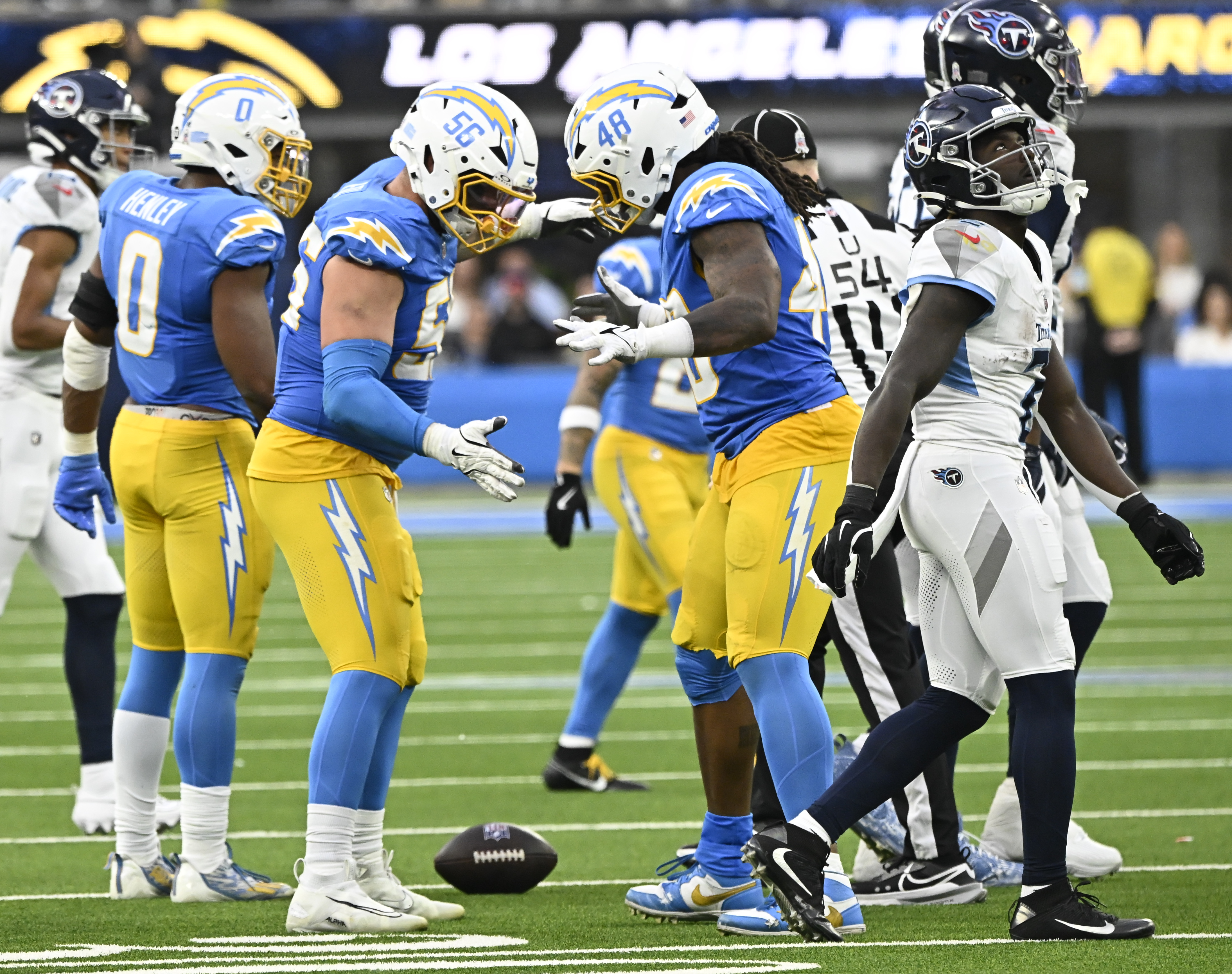 Nov 10, 2024; Inglewood, California, USA; Los Angeles Chargers defensive end Morgan Fox (56) and Los Angeles Chargers linebacker Bud Dupree (48) celebrate a sack in the third quarter at SoFi Stadium. Mandatory Credit: Robert Hanashiro-Imagn Images