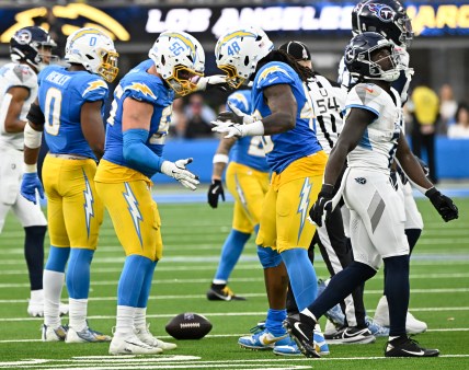 Nov 10, 2024; Inglewood, California, USA; Los Angeles Chargers defensive end Morgan Fox (56) and Los Angeles Chargers linebacker Bud Dupree (48) celebrate a sack in the third quarter at SoFi Stadium. Mandatory Credit: Robert Hanashiro-Imagn Images