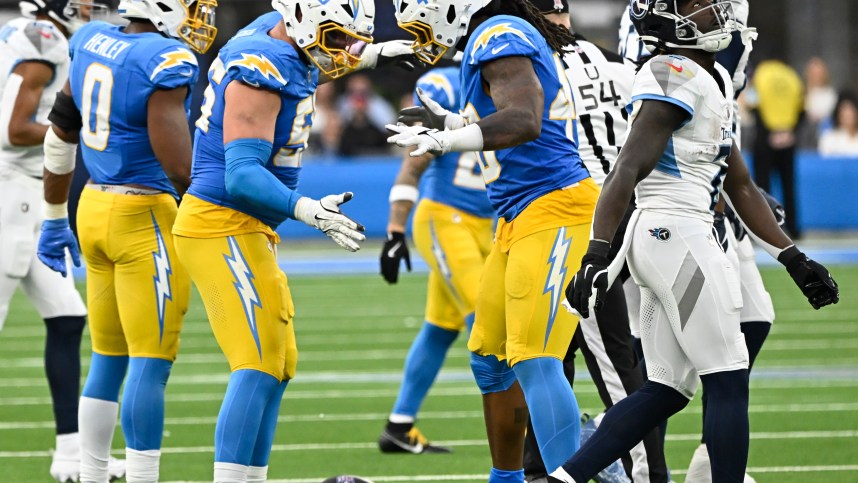 Nov 10, 2024; Inglewood, California, USA; Los Angeles Chargers defensive end Morgan Fox (56) and Los Angeles Chargers linebacker Bud Dupree (48) celebrate a sack in the third quarter at SoFi Stadium. Mandatory Credit: Robert Hanashiro-Imagn Images