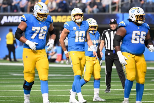 Nov 10, 2024; Inglewood, California, USA; Los Angeles Chargers offensive tackle Joe Alt (76), quarterback Justin Herbert (10), running back J.K. Dobbins (27), and Los Angeles Chargers guard Jamaree Salyer (68) during the first quarter against the Tennessee Titans at SoFi Stadium. Mandatory Credit: Robert Hanashiro-Imagn Images