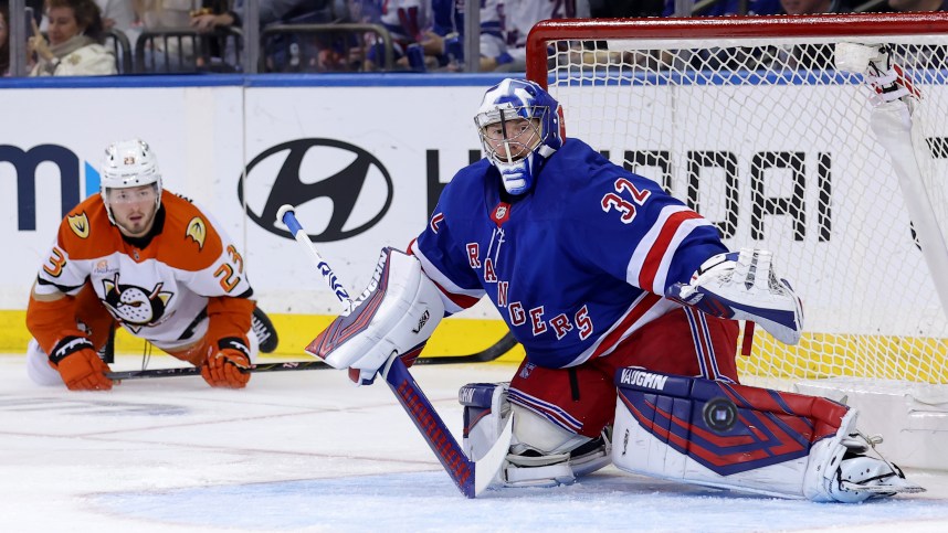 Oct 26, 2024; New York, New York, USA; New York Rangers goaltender Jonathan Quick (32) plays the puck against Anaheim Ducks center Mason McTavish (23) during the second period at Madison Square Garden. Mandatory Credit: Brad Penner-Imagn Images