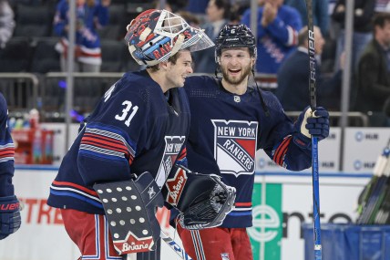 Mar 17, 2024; New York, New York, USA; New York Rangers defenseman Zac Jones (6) celebrates with goaltender Igor Shesterkin (31) after the game against the New York Islanders at Madison Square Garden. Mandatory Credit: Vincent Carchietta-Imagn Images