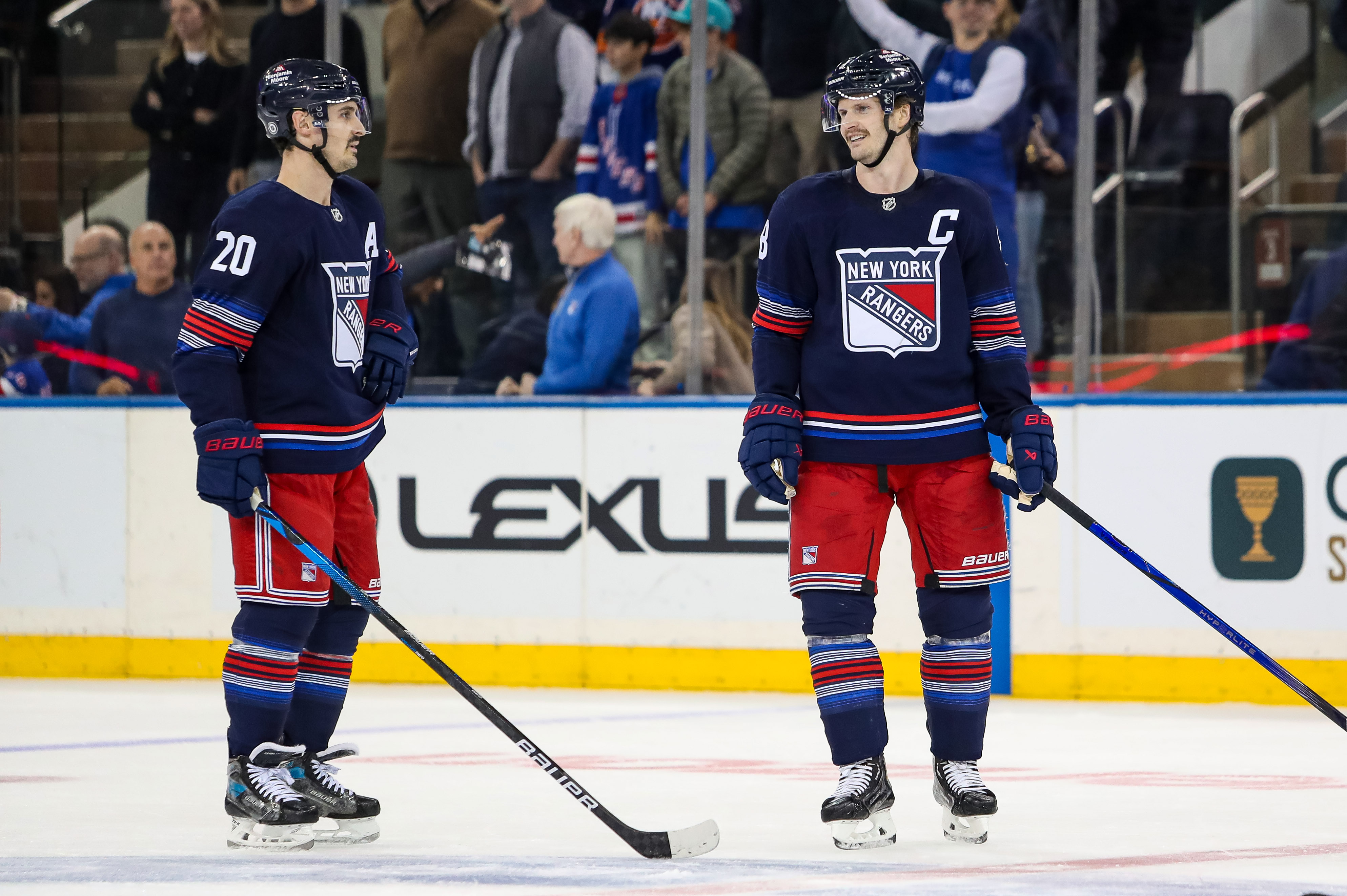 Nov 3, 2024; New York, New York, USA; New York Rangers defenseman Jacob Trouba (8) and left wing Chris Kreider (20) celebrate a win against the New York Islanders at Madison Square Garden. Mandatory Credit: Danny Wild-Imagn Images