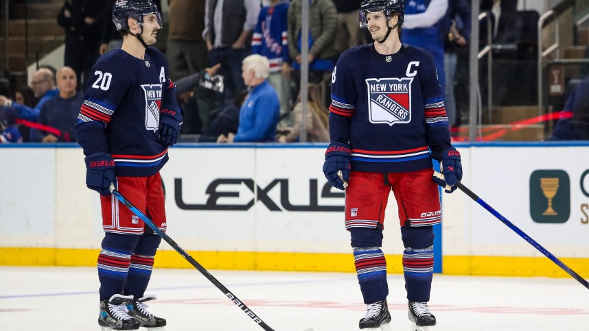 Nov 3, 2024; New York, New York, USA; New York Rangers defenseman Jacob Trouba (8) and left wing Chris Kreider (20) celebrate a win against the New York Islanders at Madison Square Garden. Mandatory Credit: Danny Wild-Imagn Images