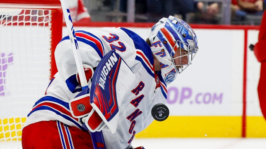 Nov 9, 2024; Detroit, Michigan, USA;  New York Rangers goaltender Jonathan Quick (32) makes a save against the Detroit Red Wings in the second period at Little Caesars Arena. Mandatory Credit: Rick Osentoski-Imagn Images