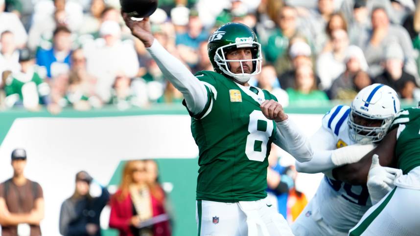 New York Jets quarterback Aaron Rodgers (8) throws the ball during the second quarter, Sunday, November 17, 2024, in East Rutherford.