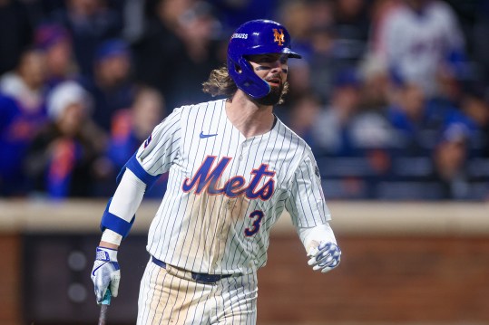 Oct 18, 2024; New York City, New York, USA; New York Mets left fielder Jesse Winker (3) singles during game five of the NLCS for the 2024 MLB playoffs against the Los Angeles Dodgers at Citi Field. Mandatory Credit: Vincent Carchietta-Imagn Images