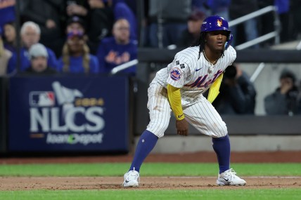 Oct 18, 2024; New York City, New York, USA; New York Mets pinch runner Luisangel Acuna (2) leads off first base during the eighth inning of game five of the NLCS against the Los Angeles Dodgers during the 2024 MLB playoffs at Citi Field. Mandatory Credit: Brad Penner-Imagn Images