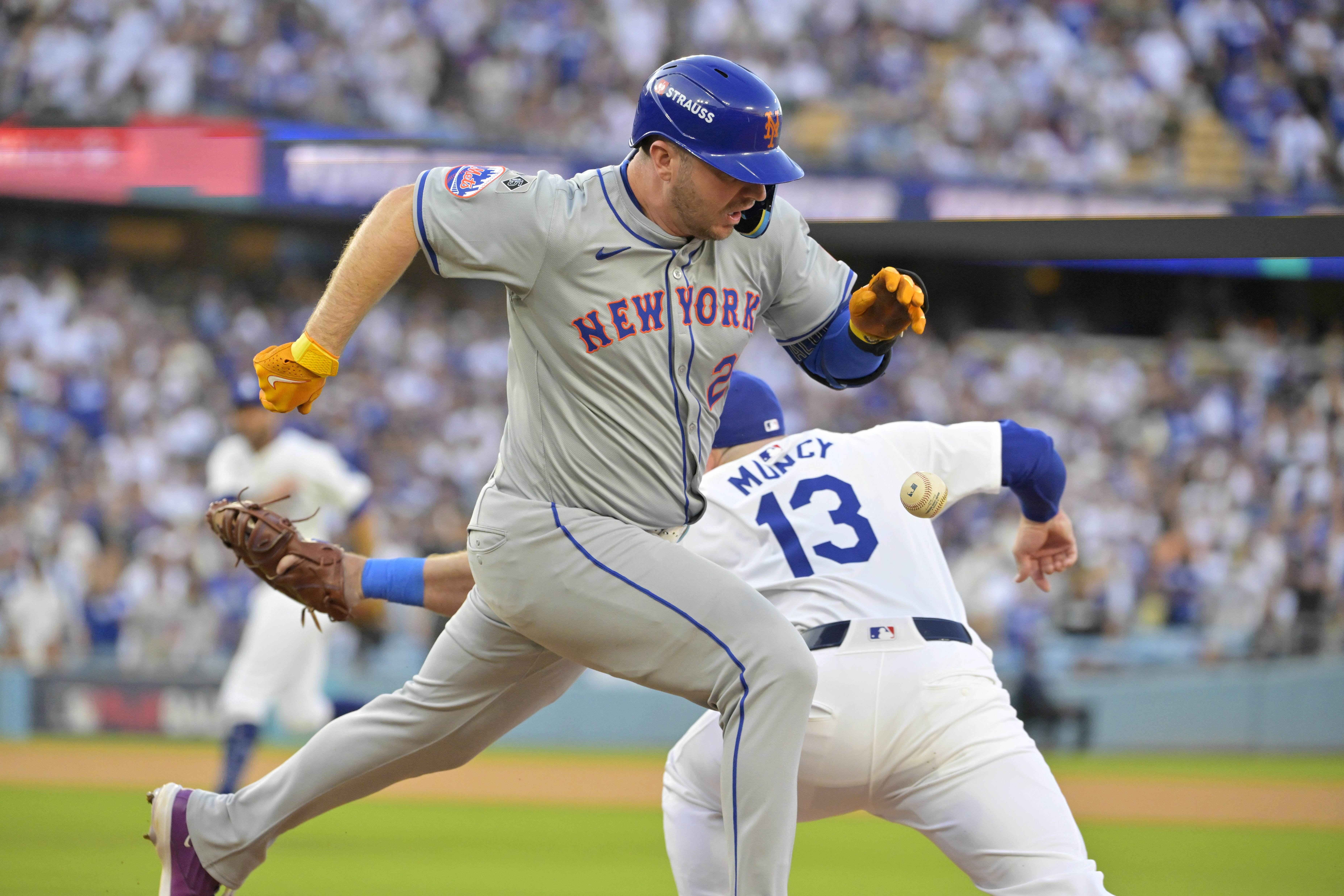 Oct 20, 2024; Los Angeles, California, USA; New York Mets first baseman Pete Alonso (20) runs to second after an error by Los Angeles Dodgers second baseman Chris Taylor (not pictured) to first baseman Max Muncy (13) in the first inning during game six of the NLCS for the 2024 MLB playoffs at Dodger Stadium. Mandatory Credit: Jayne Kamin-Oncea-Imagn Images