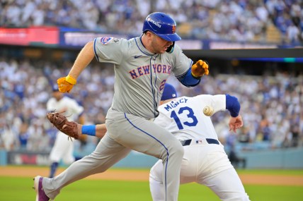 Oct 20, 2024; Los Angeles, California, USA; New York Mets first baseman Pete Alonso (20) runs to second after an error by Los Angeles Dodgers second baseman Chris Taylor (not pictured) to first baseman Max Muncy (13) in the first inning during game six of the NLCS for the 2024 MLB playoffs at Dodger Stadium. Mandatory Credit: Jayne Kamin-Oncea-Imagn Images