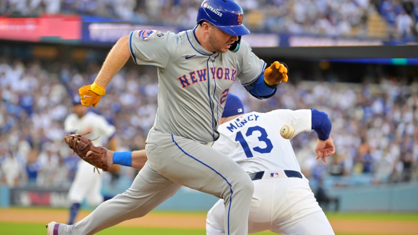 Oct 20, 2024; Los Angeles, California, USA; New York Mets first baseman Pete Alonso (20) runs to second after an error by Los Angeles Dodgers second baseman Chris Taylor (not pictured) to first baseman Max Muncy (13) in the first inning during game six of the NLCS for the 2024 MLB playoffs at Dodger Stadium. Mandatory Credit: Jayne Kamin-Oncea-Imagn Images