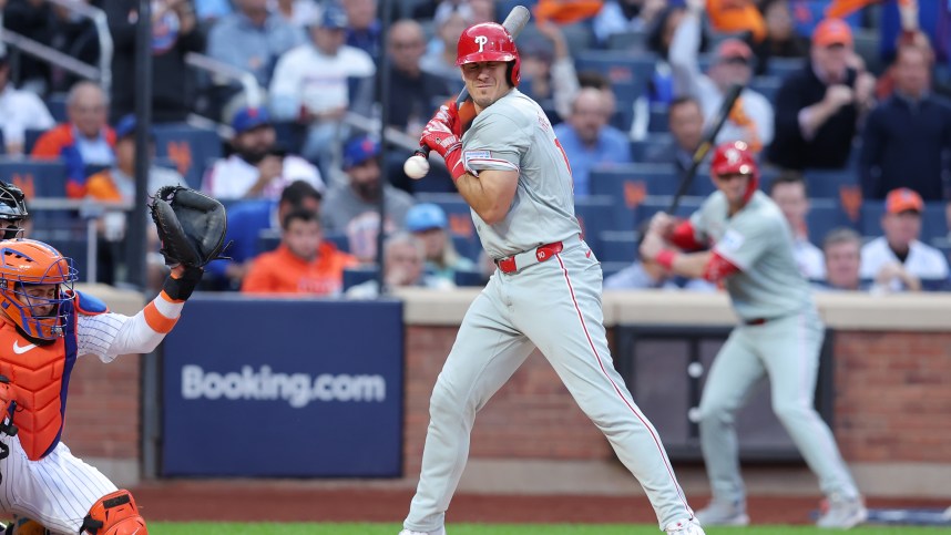 Oct 8, 2024; New York City, New York, USA; Philadelphia Phillies catcher J.T. Realmuto (10) is hit by a pitch in the second inning against the New York Mets during game three of the NLDS for the 2024 MLB Playoffs at Citi Field. Mandatory Credit: Brad Penner-Imagn Images