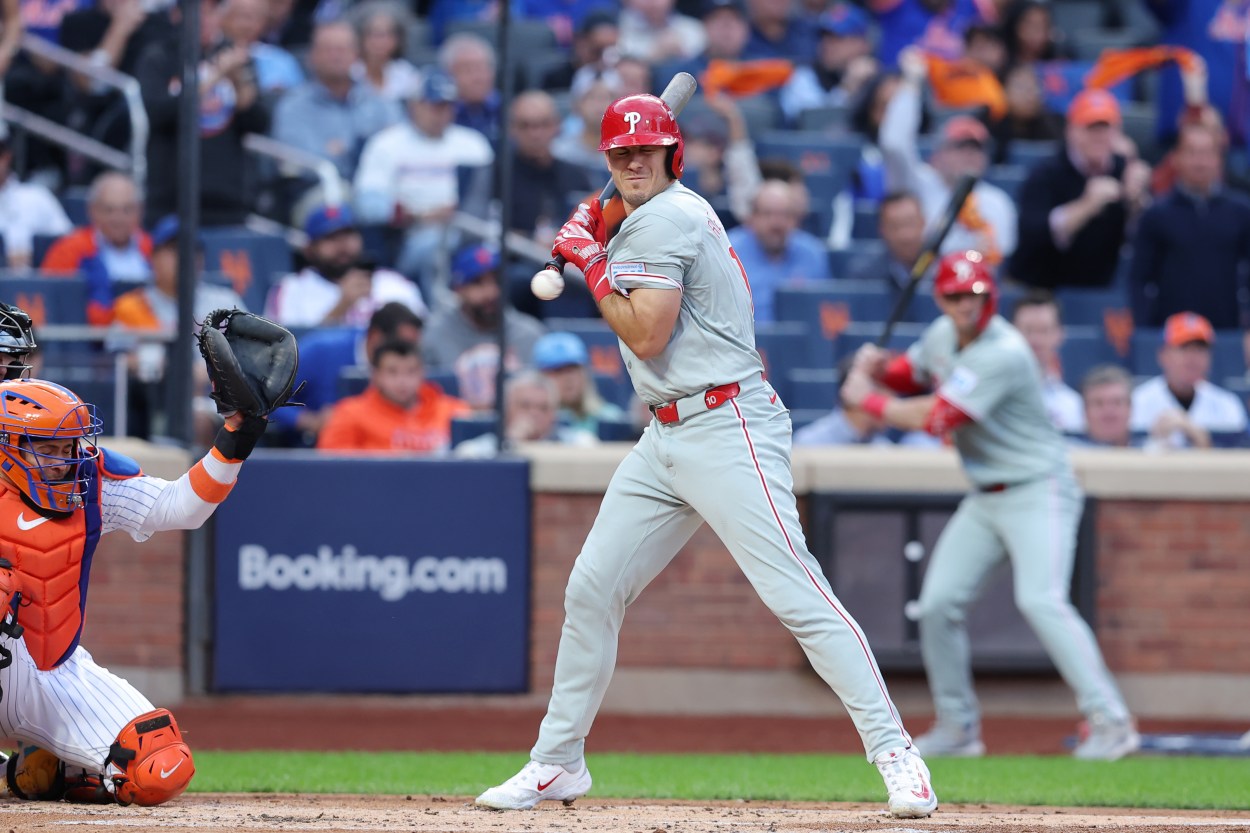 Oct 8, 2024; New York City, New York, USA; Philadelphia Phillies catcher J.T. Realmuto (10) is hit by a pitch in the second inning against the New York Mets during game three of the NLDS for the 2024 MLB Playoffs at Citi Field. Mandatory Credit: Brad Penner-Imagn Images