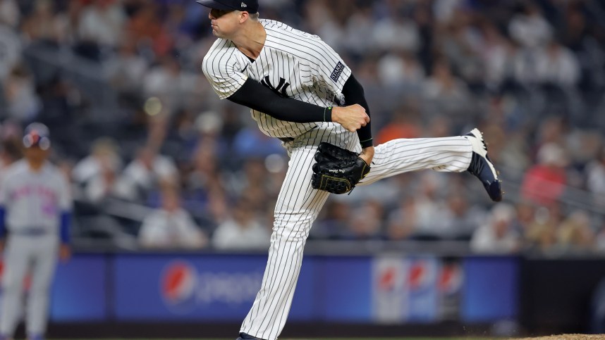 Jul 26, 2023; Bronx, New York, USA; New York Yankees relief pitcher Clay Holmes (35) follows through on a pitch against the New York Mets during the ninth inning at Yankee Stadium. Mandatory Credit: Brad Penner-Imagn Images