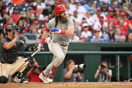 Sep 29, 2024; Washington, District of Columbia, USA; Philadelphia Phillies left fielder Brandon Marsh (16) gets ready to run to first base after hitting a single against the Washington Nationals during the eighth inning at Nationals Park. Mandatory Credit: Rafael Suanes-Imagn Images