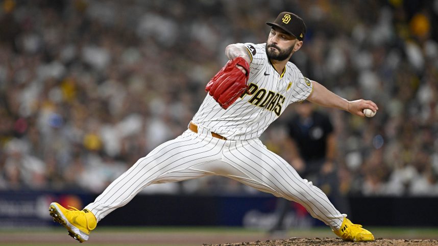 Oct 2, 2024; San Diego, California, USA; San Diego Padres pitcher Tanner Scott (66) throws during the sixth inning of game two in the Wildcard round for the 2024 MLB Playoffs against the Atlanta Braves at Petco Park. Mandatory Credit: Denis Poroy-Imagn Images