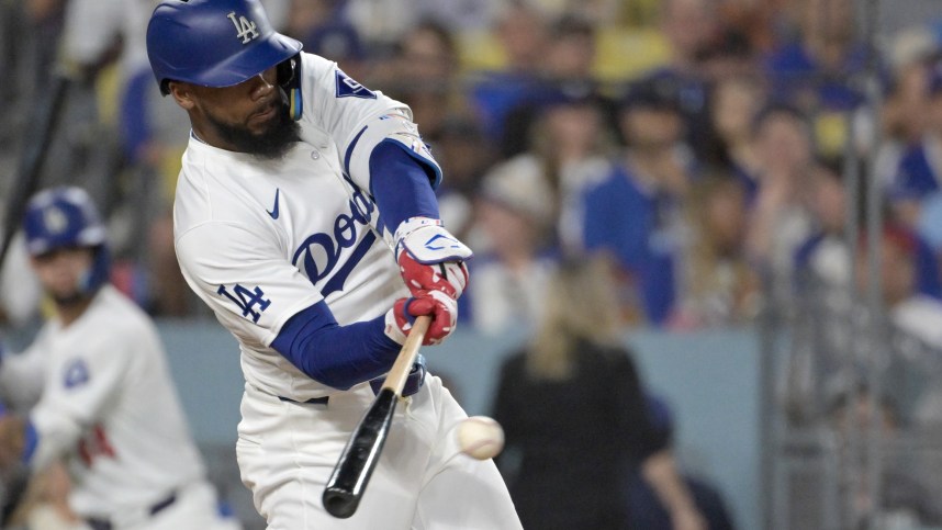 Jul 22, 2024; Los Angeles, California, USA; Los Angeles Dodgers left fielder Teoscar Hernandez (37) hits a RBI single in the sixth inning against the San Fransisco Giants at Dodger Stadium. Mandatory Credit: Jayne Kamin-Oncea-Imagn Images