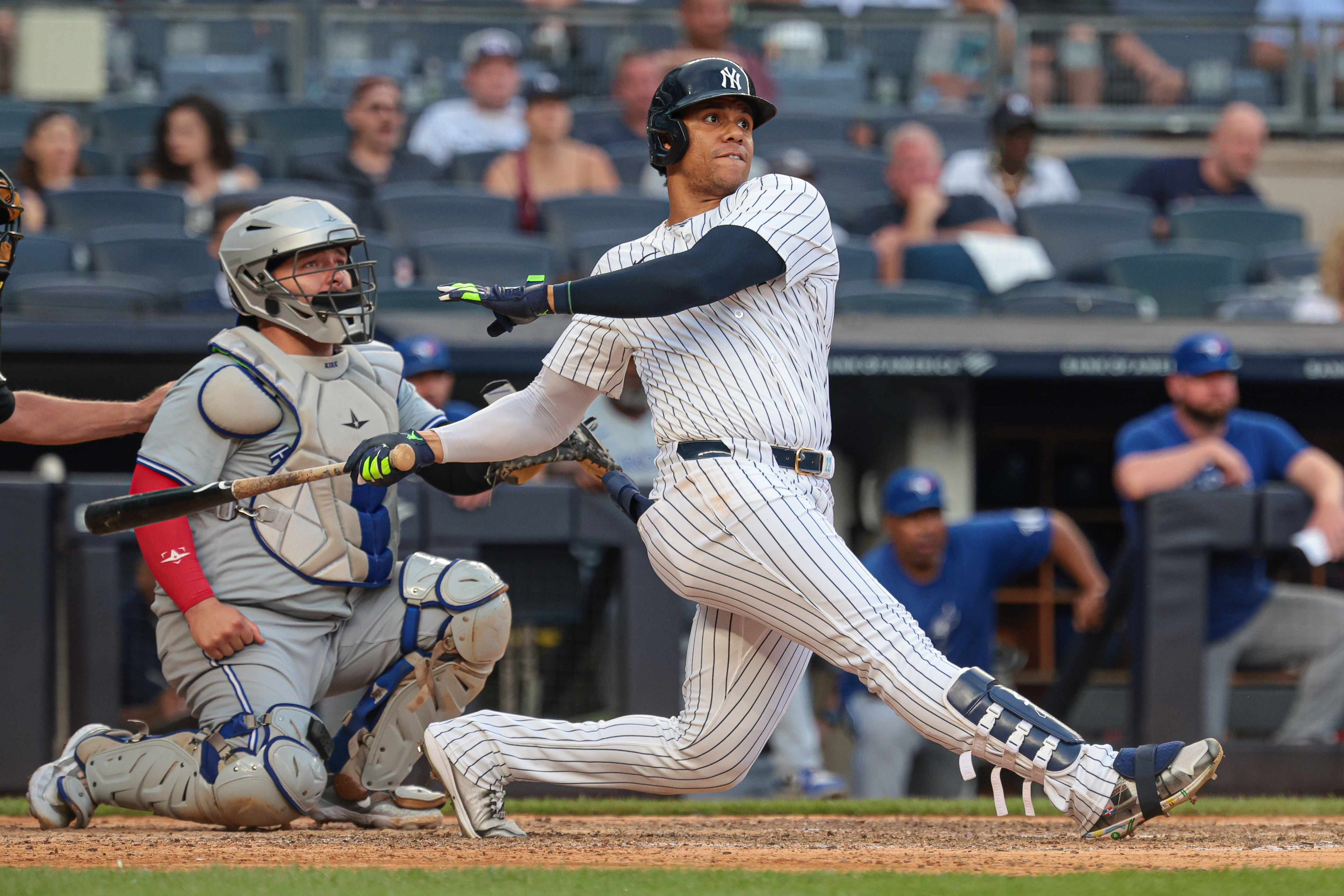 Aug 4, 2024; Bronx, New York, USA; New York Yankees right fielder Juan Soto (22) double during the eighth inning against the Toronto Blue Jays at Yankee Stadium. Mandatory Credit: Vincent Carchietta-Imagn Images