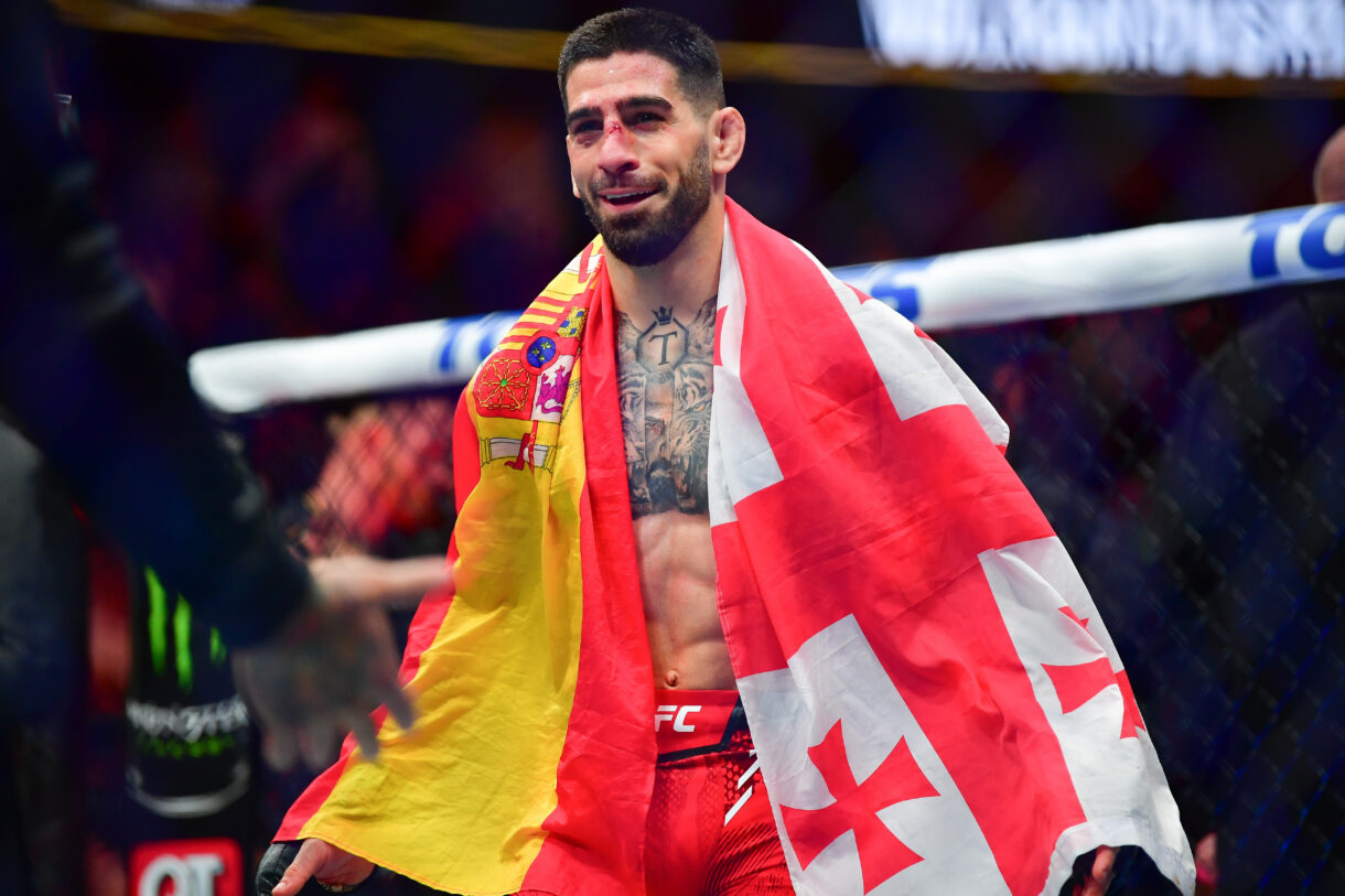 Feb 17, 2024; Anaheim, California, USA; Ilia Topuria celebrates his championship victory against Alexander Volkanovski during UFC 298 at Honda Center. Mandatory Credit: Gary A. Vasquez-Imagn Images