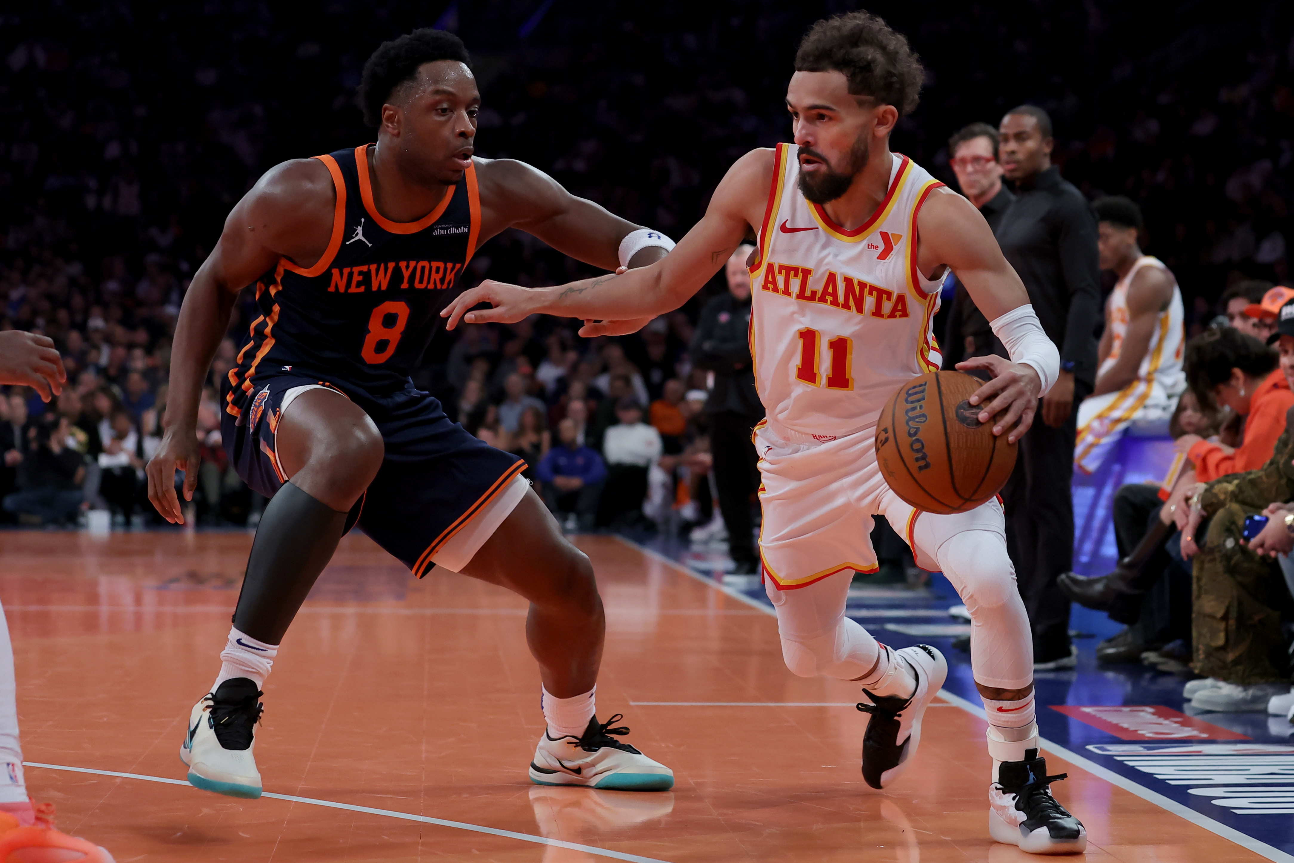 Dec 11, 2024; New York, New York, USA; Atlanta Hawks guard Trae Young (11) controls the ball against New York Knicks forward OG Anunoby (8) during the second quarter at Madison Square Garden. Mandatory Credit: Brad Penner-Imagn Images