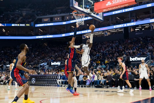 Nov 25, 2024; San Francisco, California, USA; Brooklyn Nets guard Dennis Schroder (17) shoots as Golden State Warriors forward Kevon Looney (5) defends during the first half at Chase Center. Mandatory Credit: John Hefti-Imagn Images