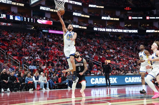 Dec 11, 2024; Houston, Texas, USA; Golden State Warriors guard Stephen Curry (30) scores a basket during the second quarter against the Houston Rockets at Toyota Center. Mandatory Credit: Troy Taormina-Imagn Images