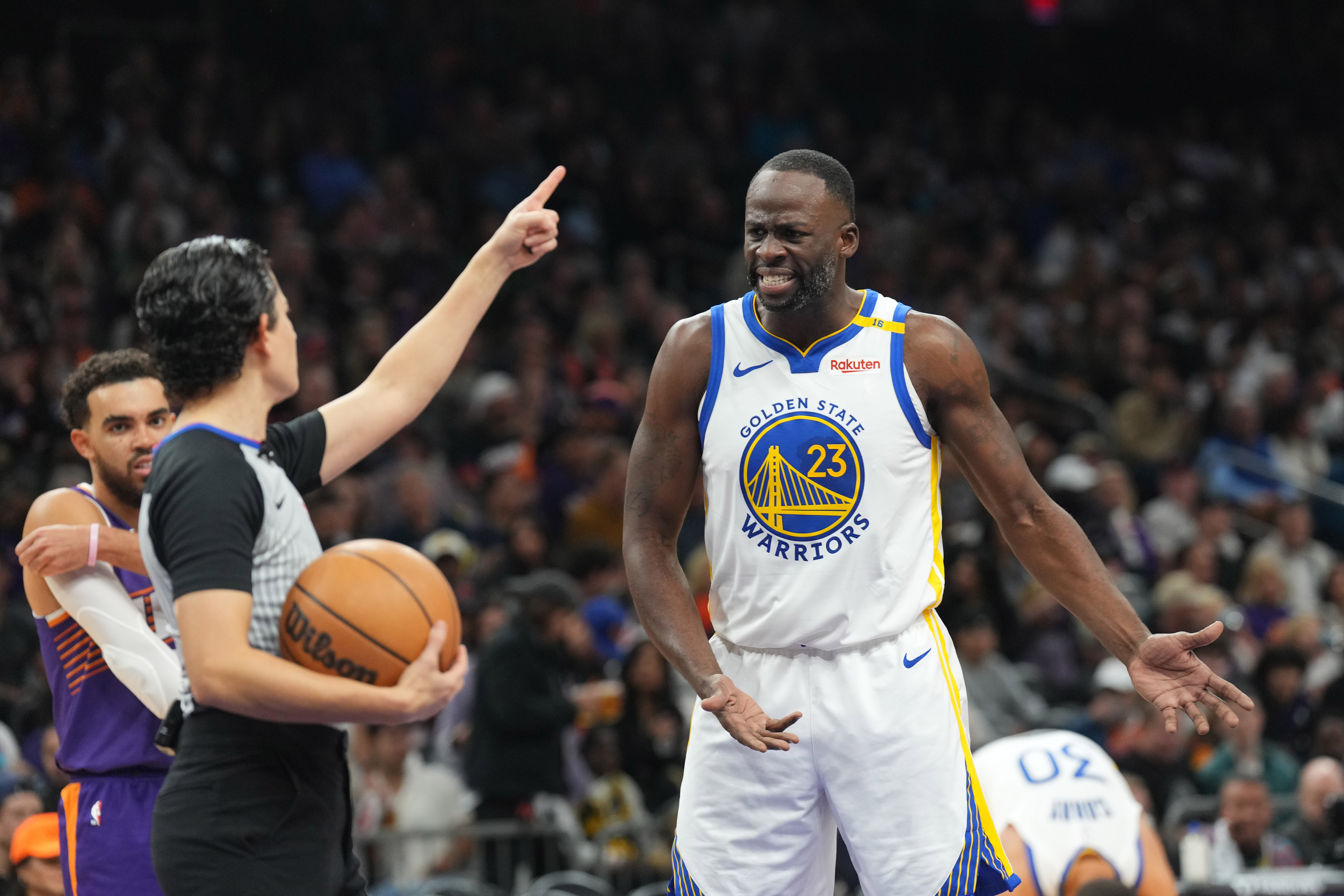 Nov 30, 2024; Phoenix, Arizona, USA; Golden State Warriors forward Draymond Green (23) argues a call during the second half against the Phoenix Suns at Footprint Center. Mandatory Credit: Joe Camporeale-Imagn Images