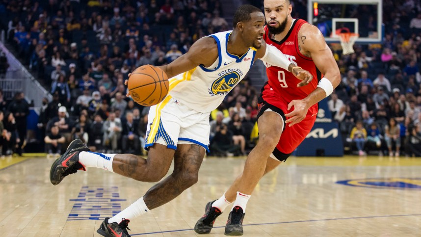 Dec 5, 2024; San Francisco, California, USA;  Golden State Warriors forward Jonathan Kuminga (00) drives past Houston Rockets forward Dillon Brooks (9) during the first quarter at Chase Center. Mandatory Credit: John Hefti-Imagn Images