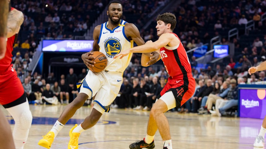 Dec 5, 2024; San Francisco, California, USA;  Houston Rockets guard Reed Sheppard (15) defends against Golden State Warriors forward Andrew Wiggins (22) during the first quarter at Chase Center. Mandatory Credit: John Hefti-Imagn Images