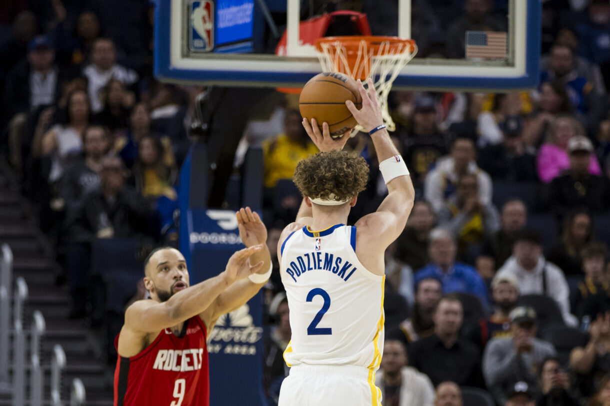 Dec 5, 2024; San Francisco, California, USA;  Golden State Warriors guard Brandin Podziemski (2) takes a three-point shot against the Houston Rockets during the fourth quarter at Chase Center. Mandatory Credit: John Hefti-Imagn Images