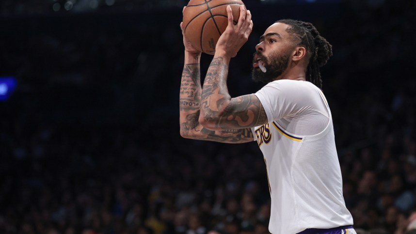 Mar 31, 2024; Brooklyn, New York, USA; Los Angeles Lakers guard D'Angelo Russell (1) shoots during the second half against the Brooklyn Nets at Barclays Center. Mandatory Credit: Vincent Carchietta-Imagn Images