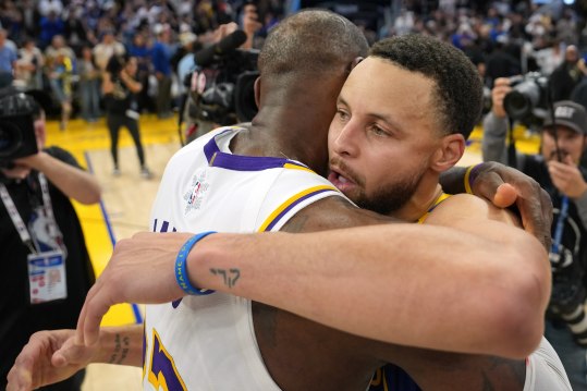 Dec 25, 2024; San Francisco, California, USA; Golden State Warriors guard Stephen Curry (center right) greets Los Angeles Lakers forward LeBron James (center left) after the game at Chase Center. Mandatory Credit: Darren Yamashita-Imagn Images