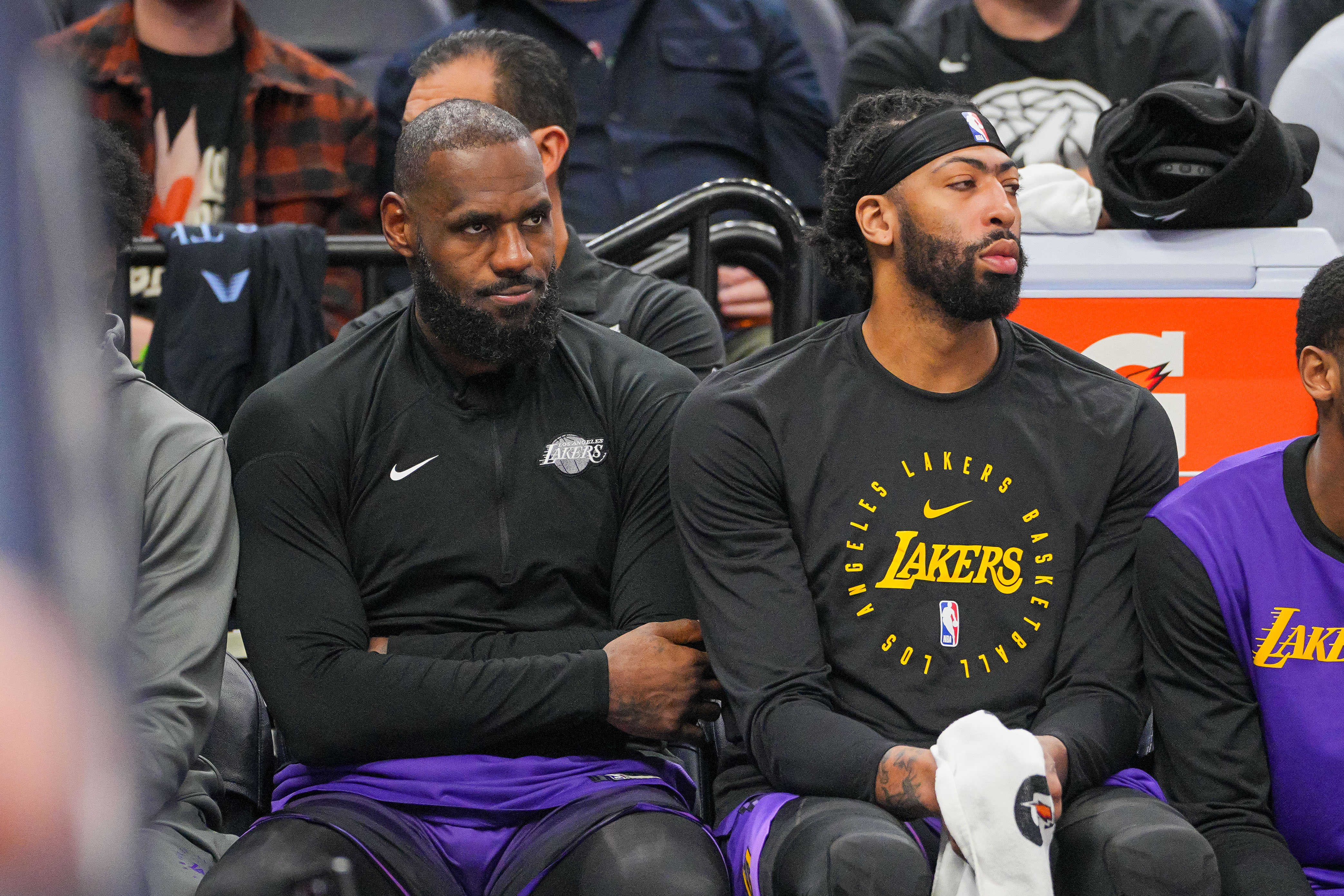 Dec 2, 2024; Minneapolis, Minnesota, USA; Los Angeles Lakers forward LeBron James (23) and forward Anthony Davis (3) on the bench against the Minnesota Timberwolves in the fourth quarter at Target Center. Mandatory Credit: Brad Rempel-Imagn Images