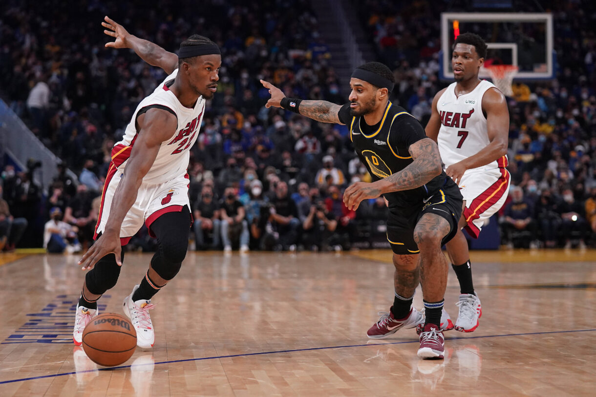 Jan 3, 2022; San Francisco, California, USA; Miami Heat forward Jimmy Butler (22) dribbles past Golden State Warriors guard Gary Payton II (0) in the second quarter at the Chase Center. Mandatory Credit: Cary Edmondson-Imagn Images