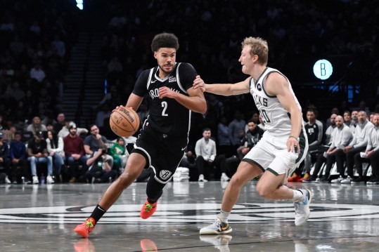 Dec 8, 2024; Brooklyn, New York, USA; Brooklyn Nets forward Cameron Johnson (2) drives to the basket while being defended by Milwaukee Bucks guard AJ Green (20) during the first half at Barclays Center. Mandatory Credit: John Jones-Imagn Images