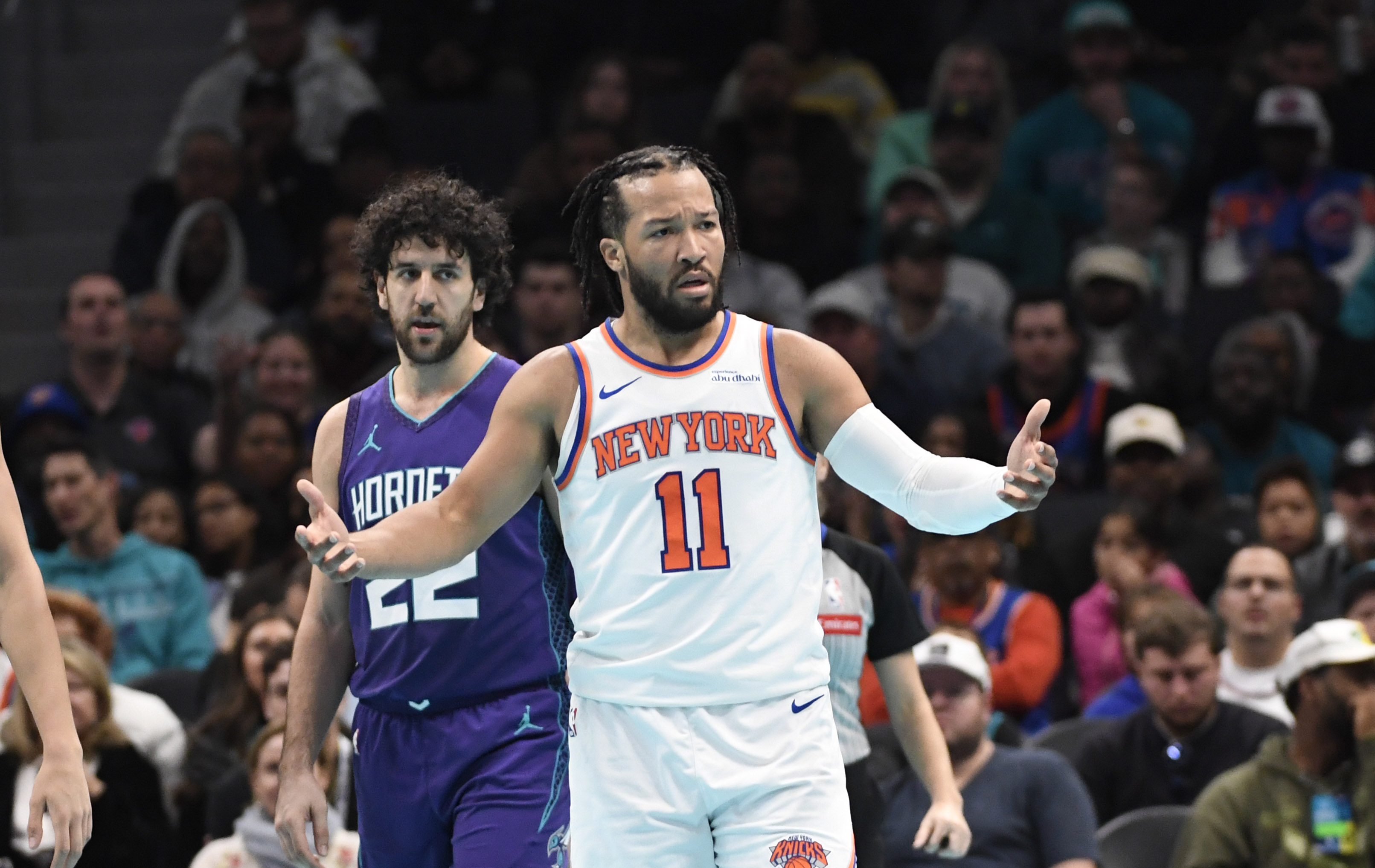 Nov 29, 2024; Charlotte, North Carolina, USA;  New York Knicks guard Jalen Brunson (11) complains about a possible foul during the second half against the Charlotte Hornets at the Spectrum Center. Mandatory Credit: Sam Sharpe-Imagn Images