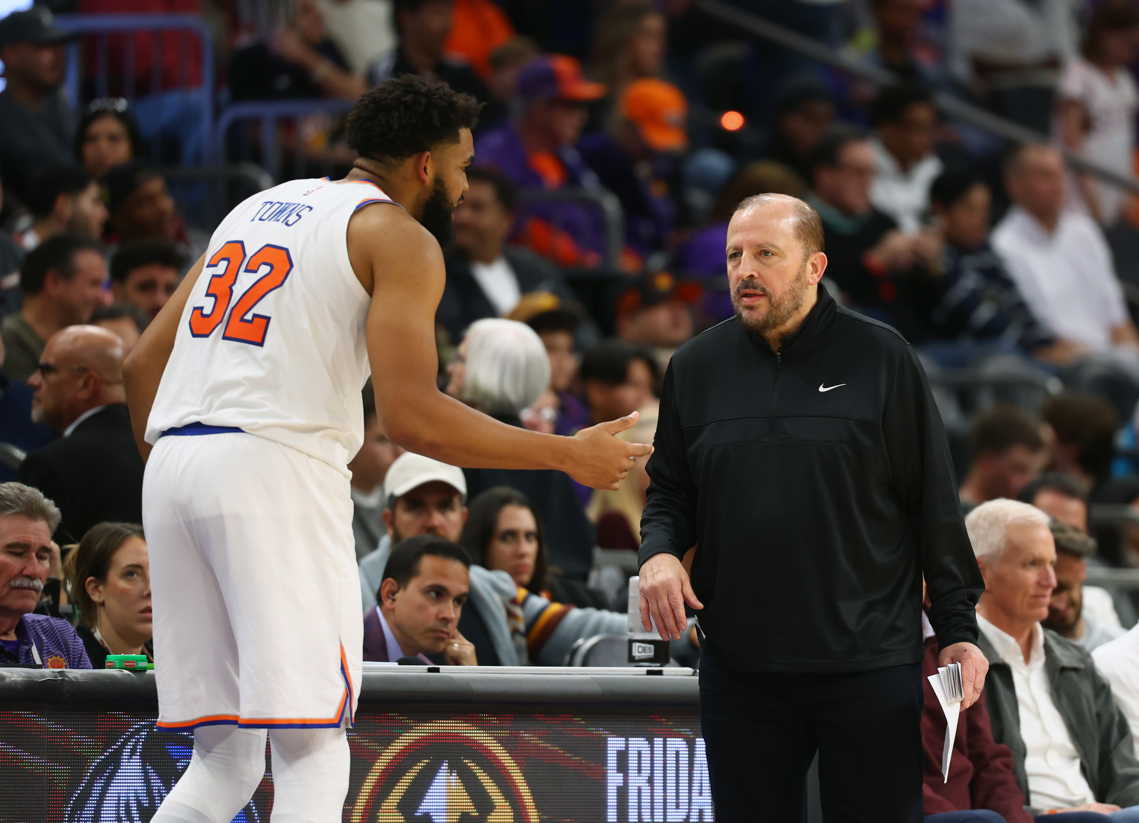 Nov 20, 2024; Phoenix, Arizona, USA; New York Knicks head coach Tom Thibodeau with center Karl-Anthony Towns (32) against the Phoenix Suns at Footprint Center. Mandatory Credit: Mark J. Rebilas-Imagn Images