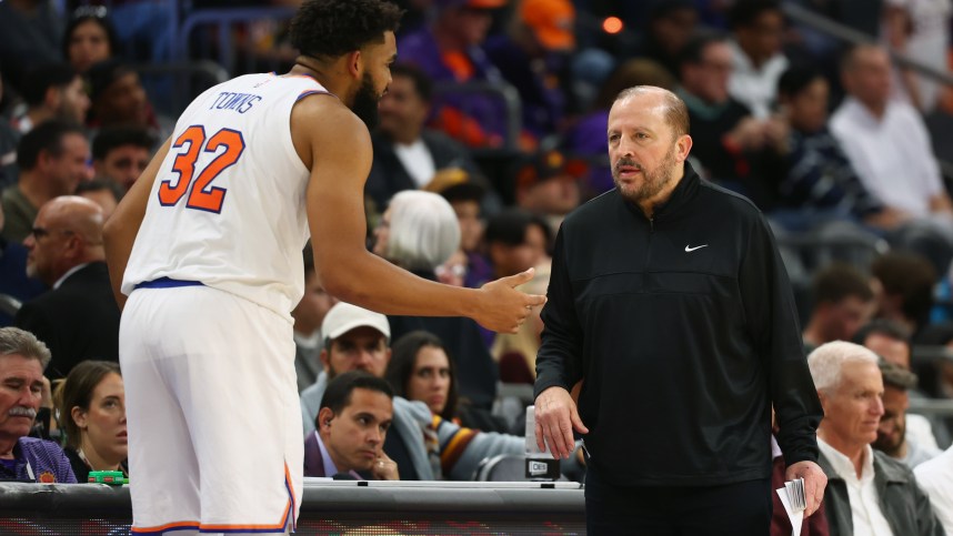 Nov 20, 2024; Phoenix, Arizona, USA; New York Knicks head coach Tom Thibodeau with center Karl-Anthony Towns (32) against the Phoenix Suns at Footprint Center. Mandatory Credit: Mark J. Rebilas-Imagn Images