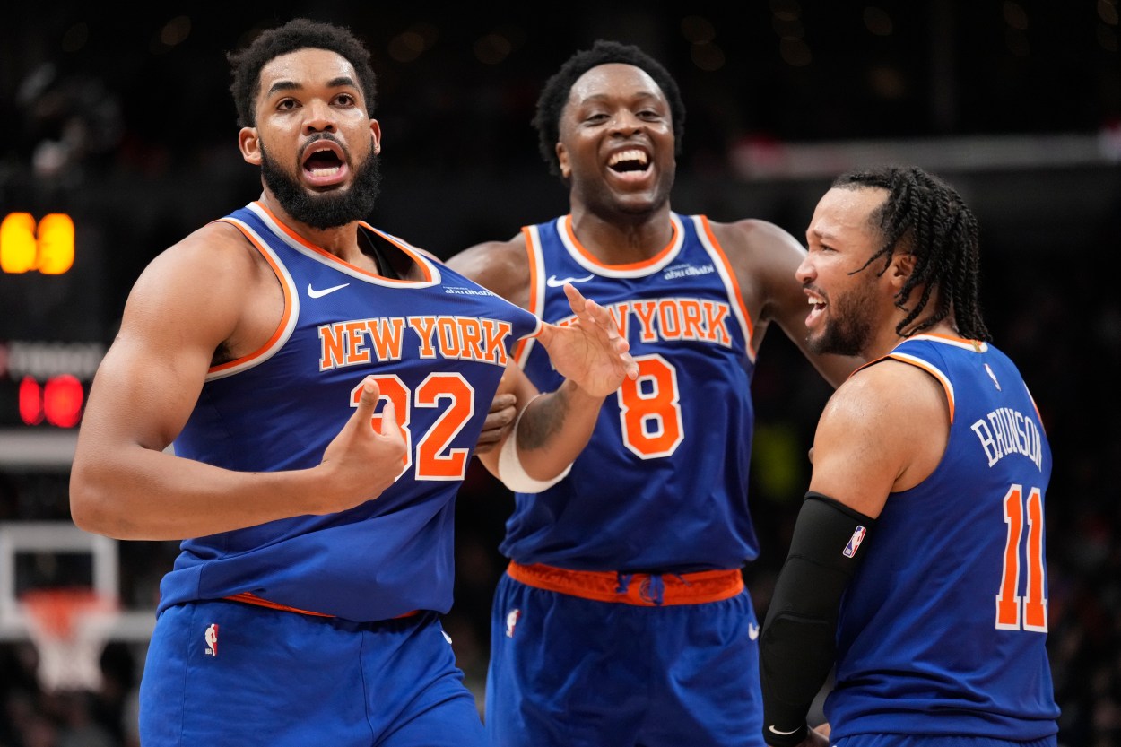 Dec 9, 2024; Toronto, Ontario, CAN; New York  Knicks guard Jalen Brunson (11) and forward OG Anunoby (8) react after a three point basket by center Karl-Anthony Towns (32) to clinch a win over the Toronto Raptors during the second half at Scotiabank Arena. Mandatory Credit: John E. Sokolowski-Imagn Images