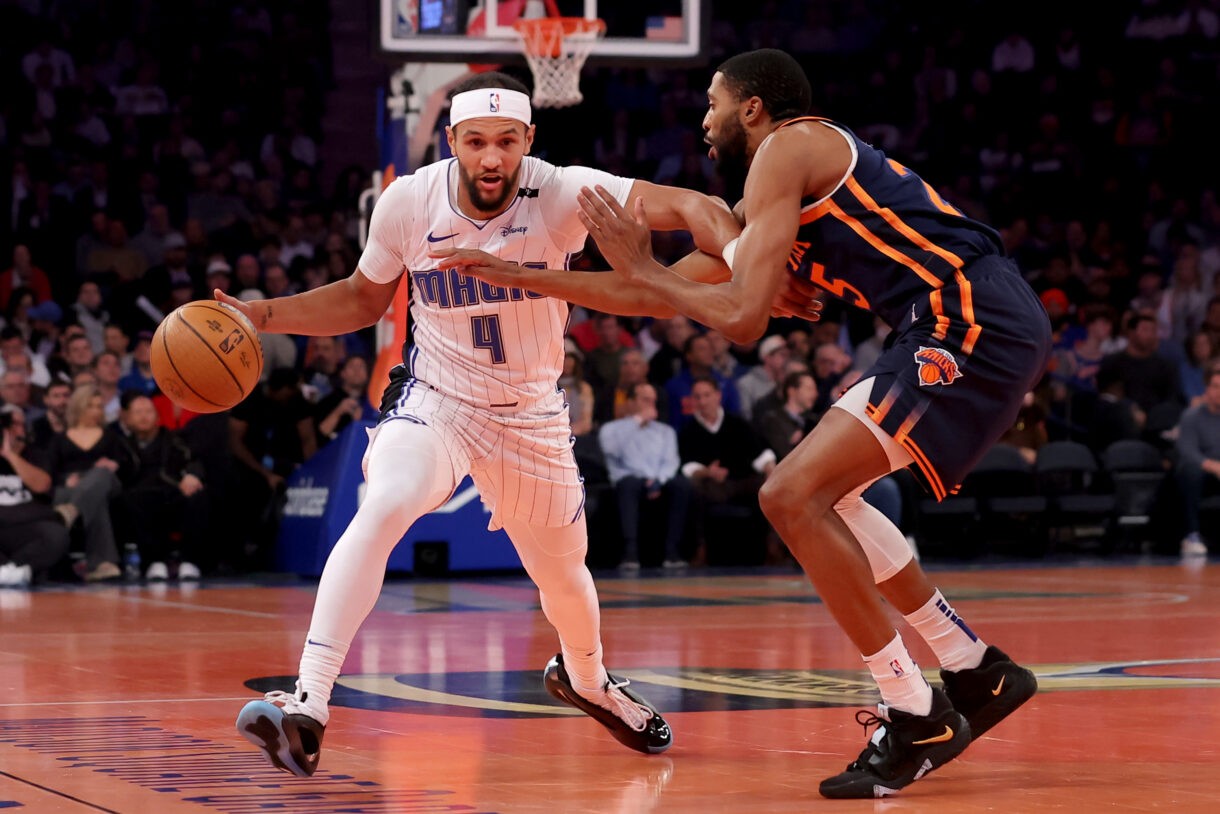 Dec 3, 2024; New York, New York, USA; Orlando Magic guard Jalen Suggs (4) controls the ball against New York Knicks forward Mikal Bridges (25) during the first quarter at Madison Square Garden. Mandatory Credit: Brad Penner-Imagn Images