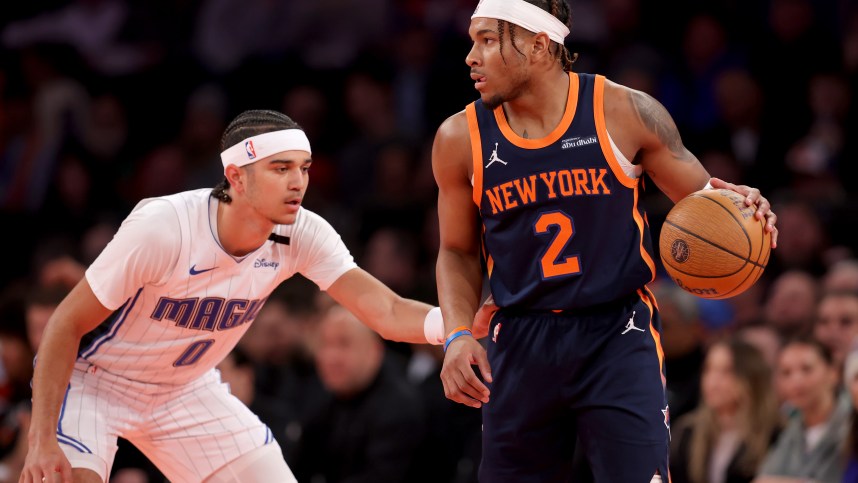 Dec 3, 2024; New York, New York, USA; New York Knicks guard Miles McBride (2) controls the ball against Orlando Magic guard Anthony Black (0) during the first quarter at Madison Square Garden. Mandatory Credit: Brad Penner-Imagn Images