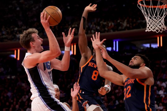 Dec 3, 2024; New York, New York, USA; Orlando Magic forward Franz Wagner (22) drives to the basket against New York Knicks guard Josh Hart (3) and forward OG Anunoby (8) and center Karl-Anthony Towns (32) during the second quarter at Madison Square Garden. Mandatory Credit: Brad Penner-Imagn Images