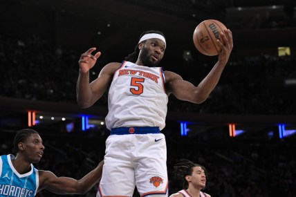 Oct 15, 2024; New York, New York, USA; New York Knicks forward Precious Achiuwa (5) grabs a rebound against the Charlotte Hornets during the second half at Madison Square Garden. Mandatory Credit: John Jones-Imagn Images