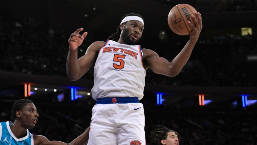 Oct 15, 2024; New York, New York, USA; New York Knicks forward Precious Achiuwa (5) grabs a rebound against the Charlotte Hornets during the second half at Madison Square Garden. Mandatory Credit: John Jones-Imagn Images