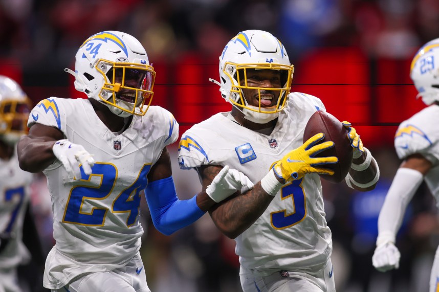 Dec 1, 2024; Atlanta, Georgia, USA; Los Angeles Chargers safety Derwin James Jr. (3) celebrates with safety Marcus Maye (24) and cornerback Tarheeb Still (29) after an interception against the Atlanta Falcons in the fourth quarter at Mercedes-Benz Stadium. Mandatory Credit: Brett Davis-Imagn Images