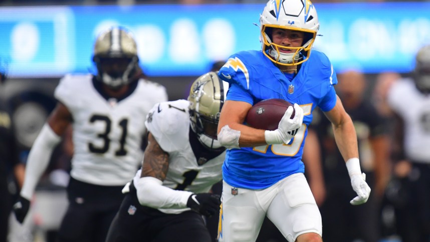 Oct 27, 2024; Inglewood, California, USA; Los Angeles Chargers wide receiver Ladd McConkey (15) runs the ball for a touchdown against the New Orleans Saints during the second half at SoFi Stadium. Mandatory Credit: Gary A. Vasquez-Imagn Images