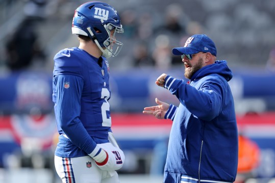 Dec 8, 2024; East Rutherford, New Jersey, USA; New York Giants head coach Brian Daboll talks to quarterback Drew Lock (2) before a game against the New Orleans Saints at MetLife Stadium. Mandatory Credit: Brad Penner-Imagn Images