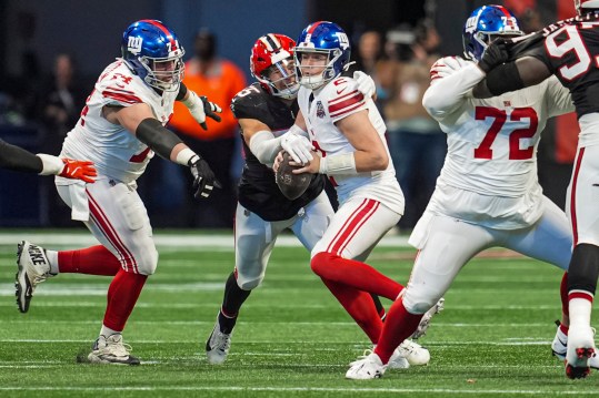 Dec 22, 2024; Atlanta, Georgia, USA; Atlanta Falcons linebacker Kaden Elliss (55) knocks the ball out of the hands of New York Giants quarterback Drew Lock (2) during the first half at Mercedes-Benz Stadium. Mandatory Credit: Dale Zanine-Imagn Images