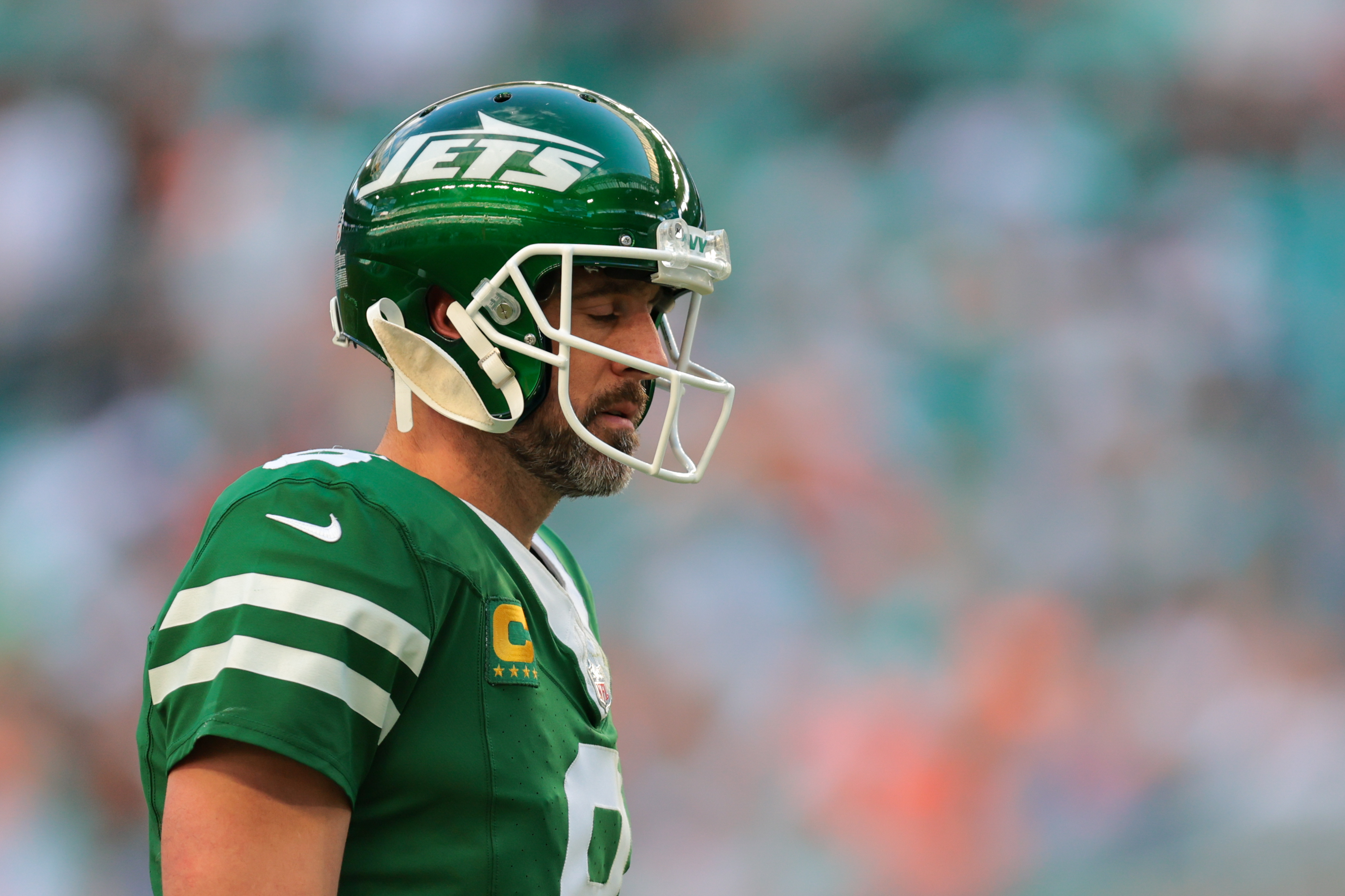 Dec 8, 2024; Miami Gardens, Florida, USA; New York Jets quarterback Aaron Rodgers (8) reacts on the field against the Miami Dolphins during the fourth quarter at Hard Rock Stadium. Mandatory Credit: Sam Navarro-Imagn Images